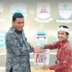 Bupati Purwakarta Saepul Bahri Binzein menerima penghargaan Opini Wajar Tanpa Pengecualian (WTP) dari BPK di kantor Badan Pemeriksa Keungan (BPK) RI Perwakilan Provinsi Jawa Barat, di Bandung, Selasa 9 Juni 2026.